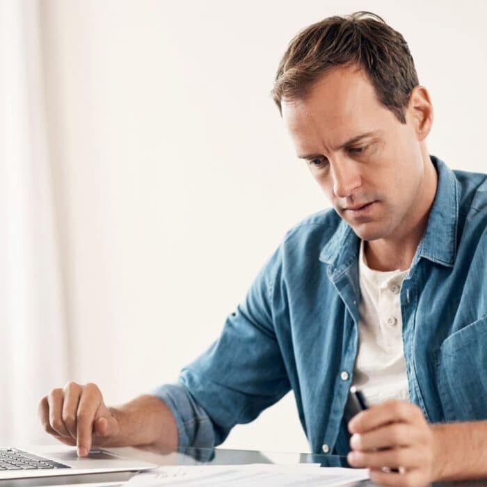 Frustrated man working on computer