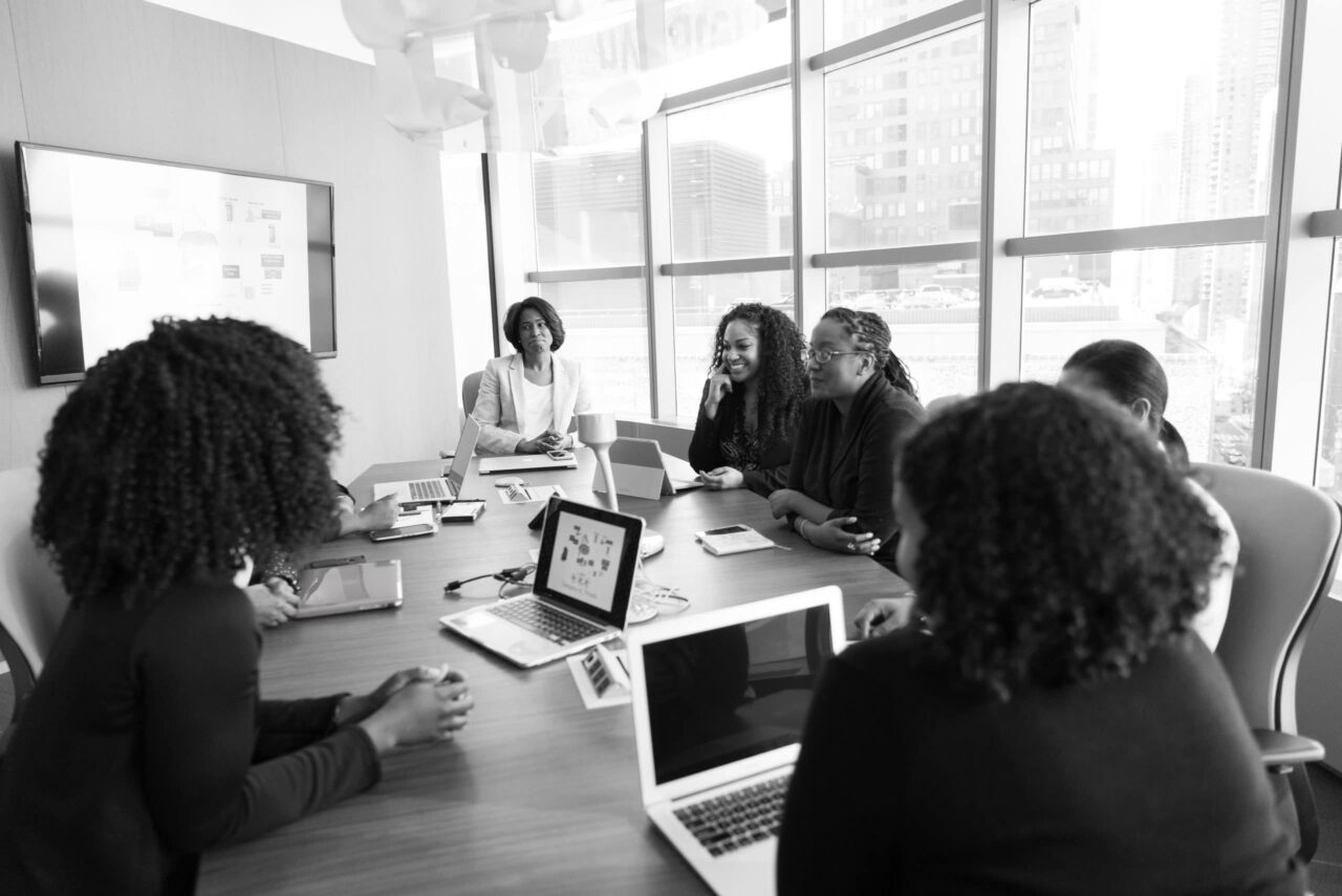 people sitting at a conference table