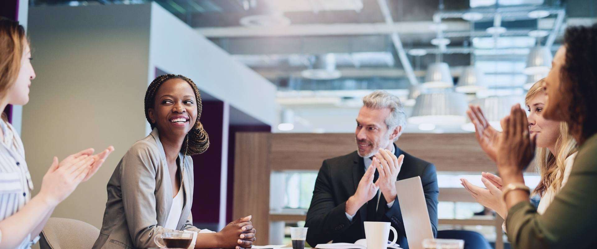 Coworkers clapping for each other