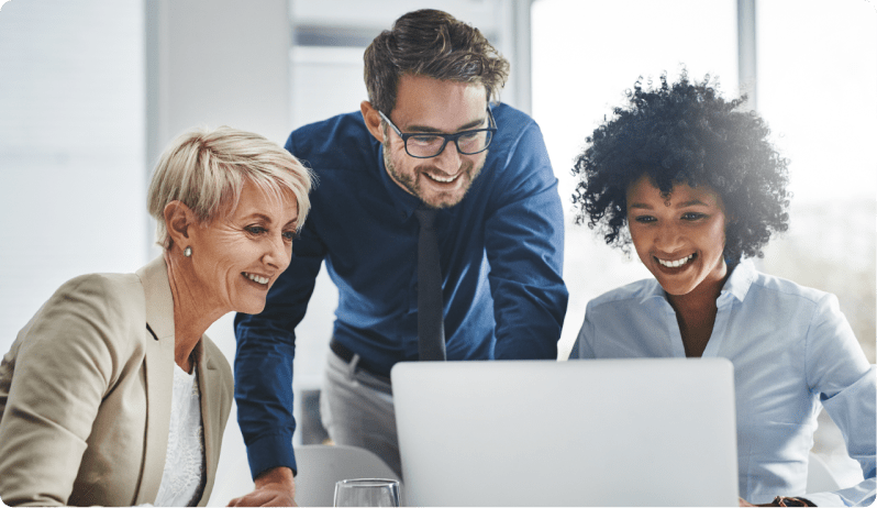 group of coworkers looking at computer