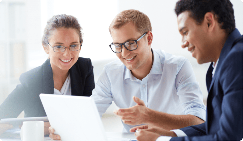 group of coworkers looking at computer