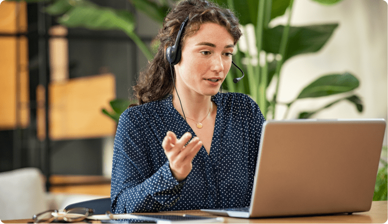 customer services representative talking on laptop