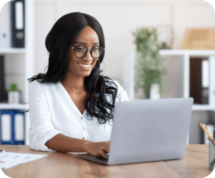 smiling woman working on laptop