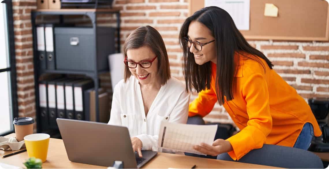 two women working together in an office